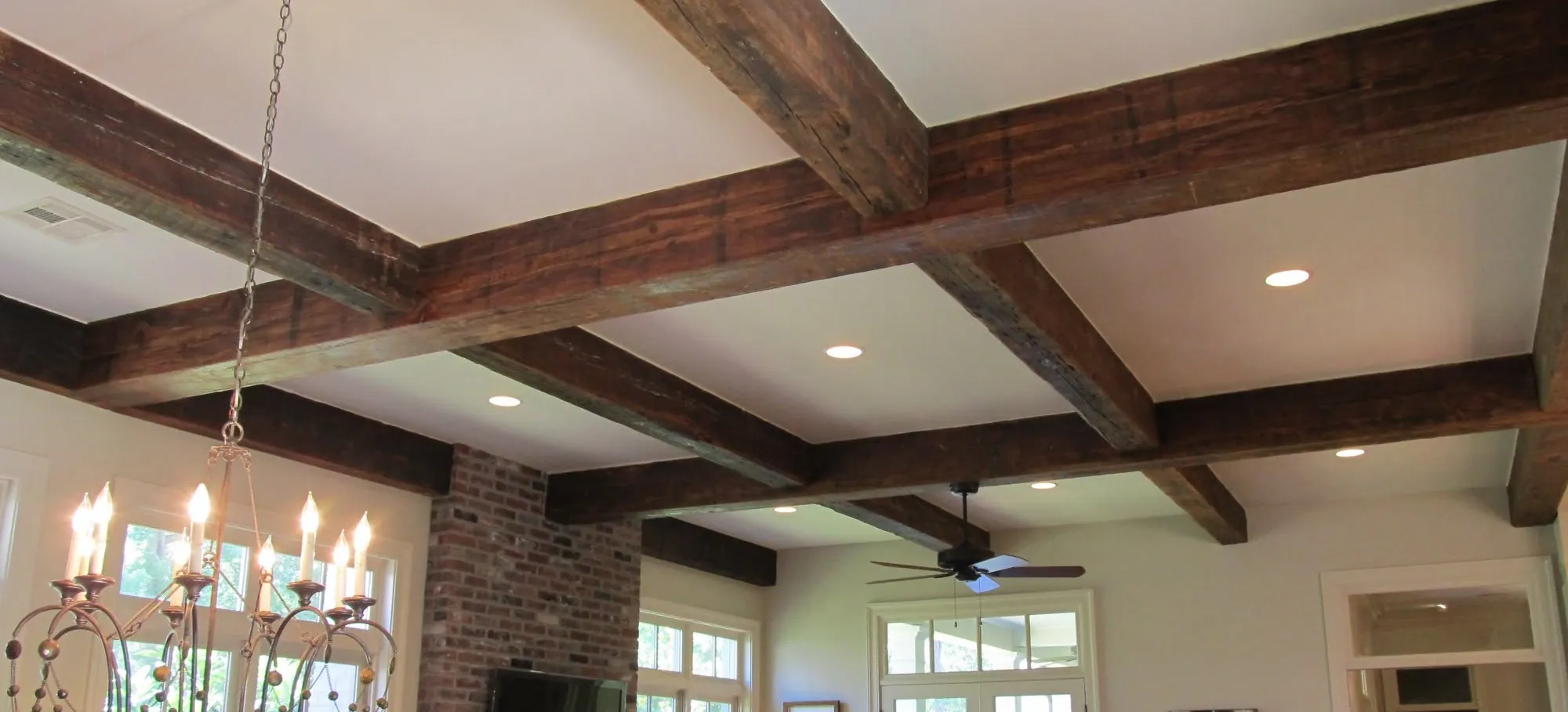 Reclaimed Beams — Structural or applied. Hand hewn, rough sawn, or skip planed.