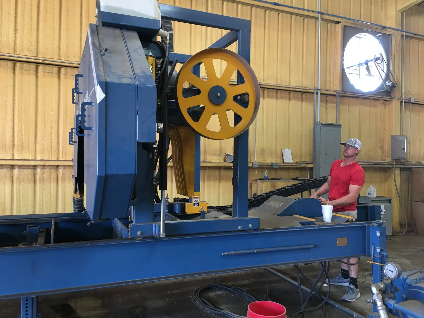 Dustin Moreau running the beam saw inside the mill