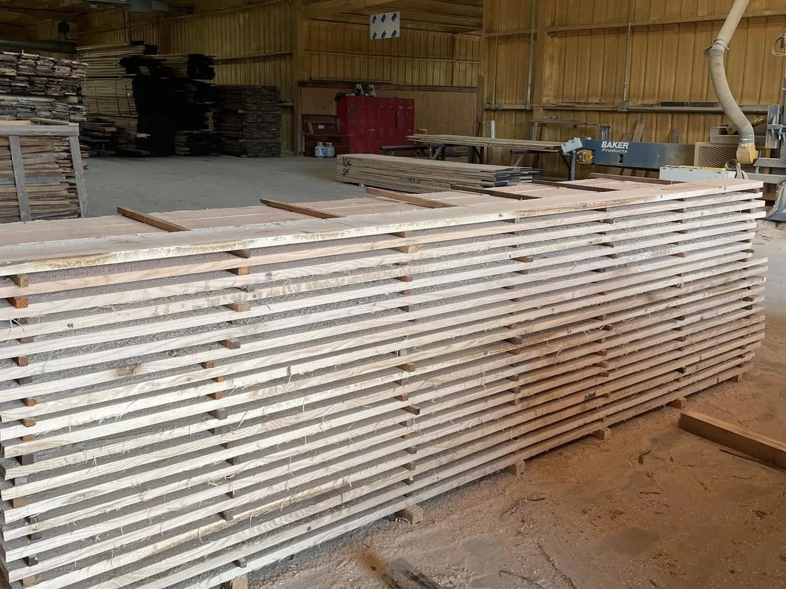 Boards stickered and stacked on the shop floor